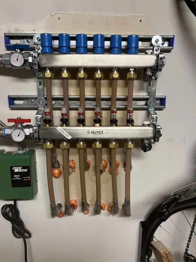 Plumber performing Gas Line Installation at a residential property in Cleves